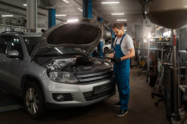 A mechanic in a car repair shop